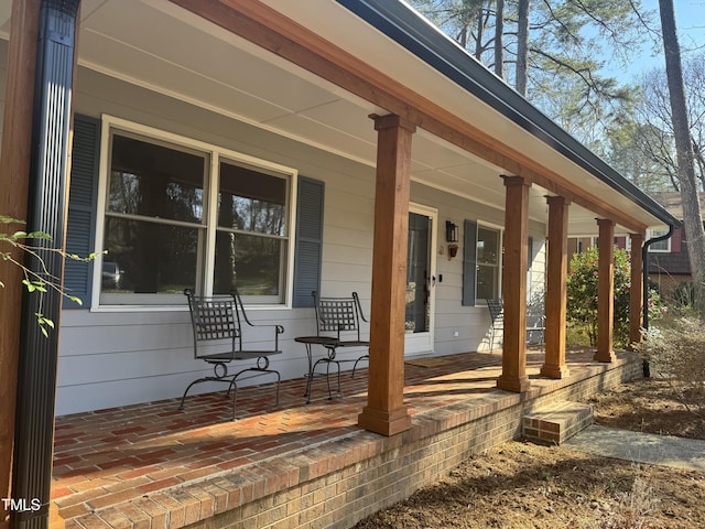 view of patio featuring a porch