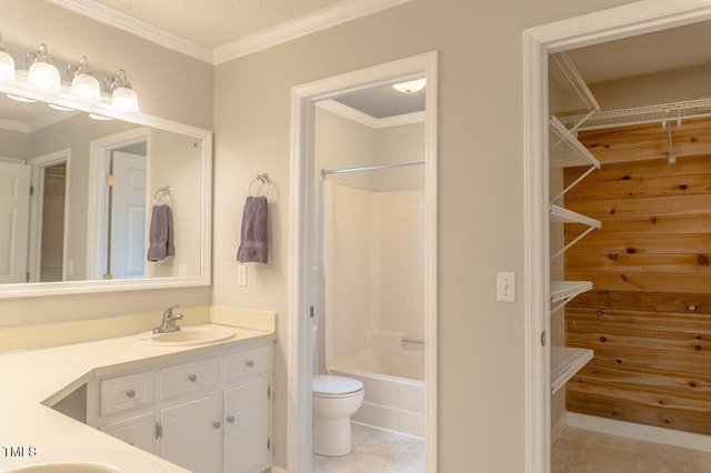 bathroom with toilet, ornamental molding, a spacious closet, vanity, and shower / washtub combination