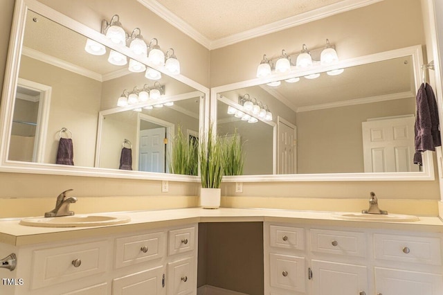 bathroom with ornamental molding and vanity