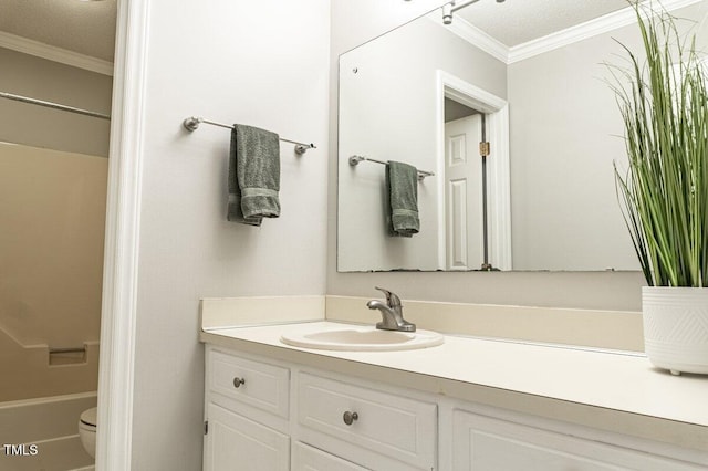 bathroom with toilet, shower / bathtub combination, vanity, and crown molding