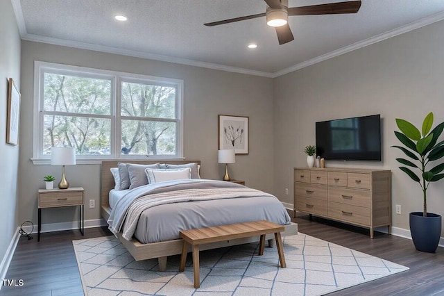 bedroom with recessed lighting, crown molding, baseboards, and wood finished floors