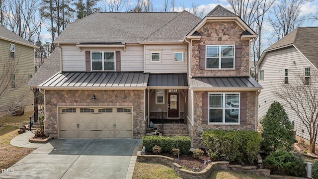 view of front of home with metal roof, driveway, stone siding, an attached garage, and a standing seam roof