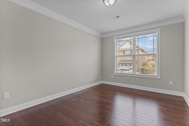 unfurnished room with visible vents, baseboards, ornamental molding, and dark wood-style flooring