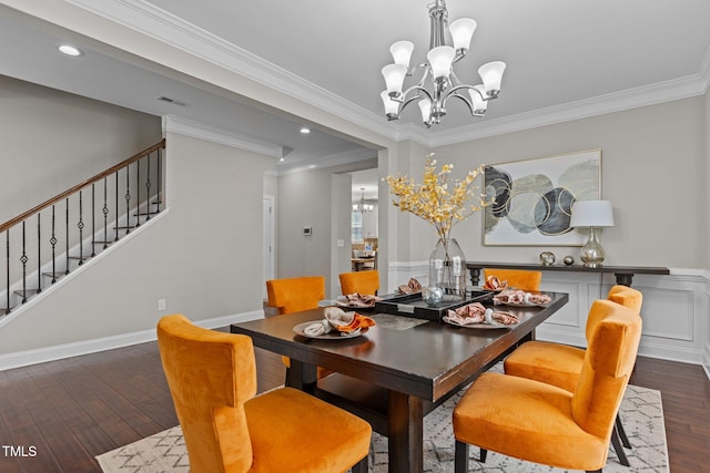 dining area featuring a notable chandelier, ornamental molding, stairway, and wood-type flooring