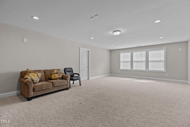 sitting room with recessed lighting, baseboards, and carpet