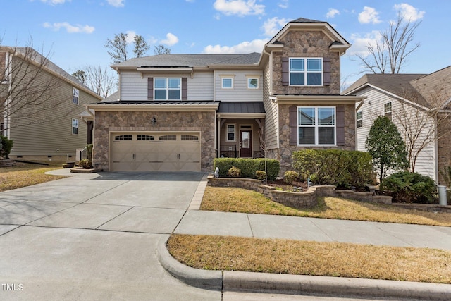 view of front facade with a standing seam roof, an attached garage, concrete driveway, stone siding, and metal roof