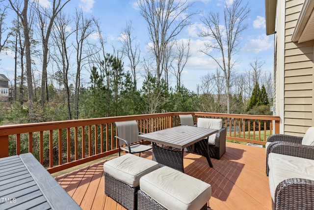 wooden deck featuring outdoor dining space