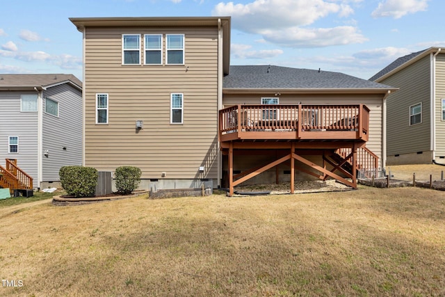 back of property featuring crawl space, a wooden deck, a lawn, and stairs