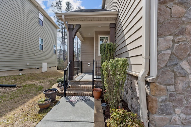 doorway to property featuring stone siding