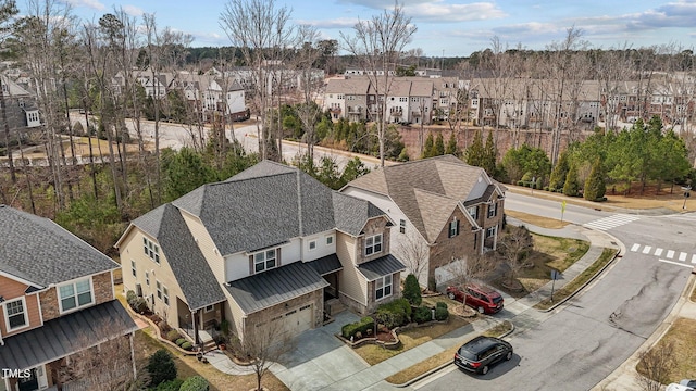 birds eye view of property with a residential view