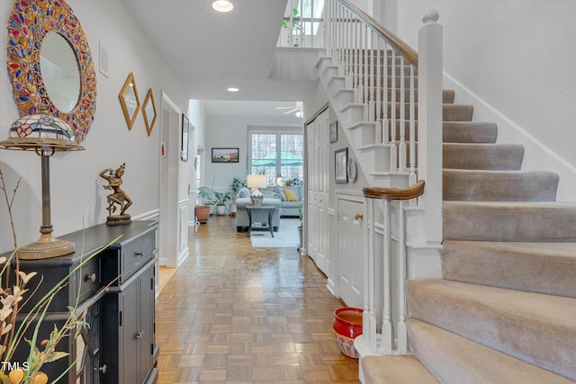 entryway with stairway and recessed lighting