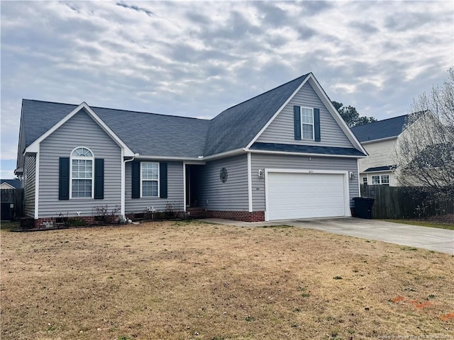 traditional-style home featuring crawl space, fence, a garage, driveway, and a front lawn