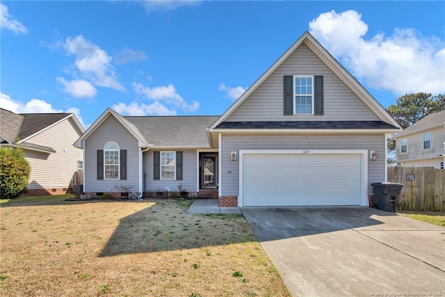 view of front facade with a garage, a front lawn, driveway, and fence