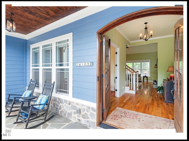 view of exterior entry with covered porch