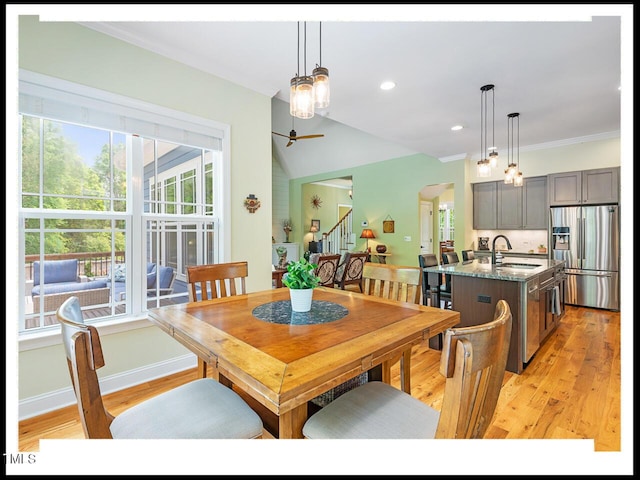 dining space with recessed lighting, light wood-style flooring, stairs, and baseboards