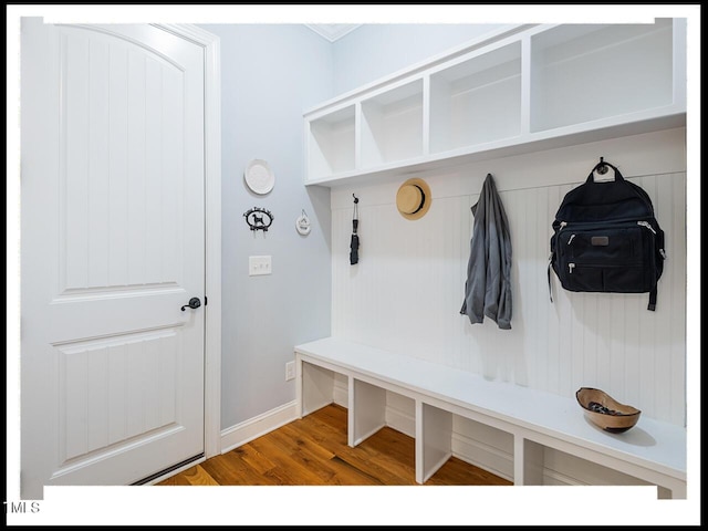 mudroom with baseboards and wood finished floors