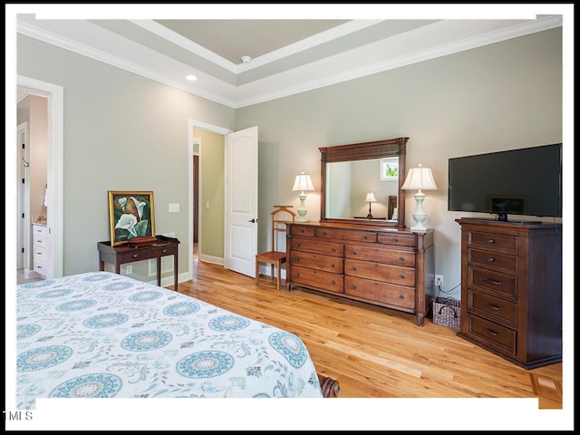 bedroom featuring light wood-style floors and ornamental molding