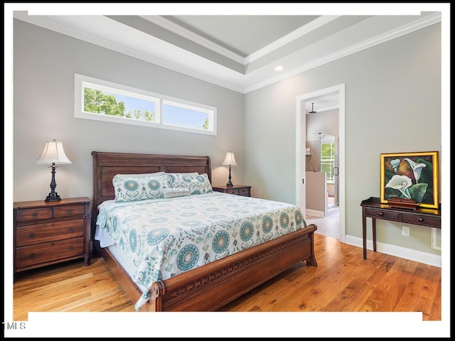 bedroom featuring crown molding, baseboards, and light wood-type flooring