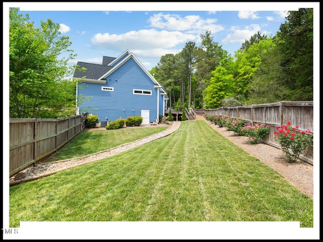 view of yard with a fenced backyard