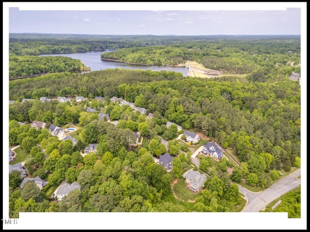 aerial view with a view of trees and a water view