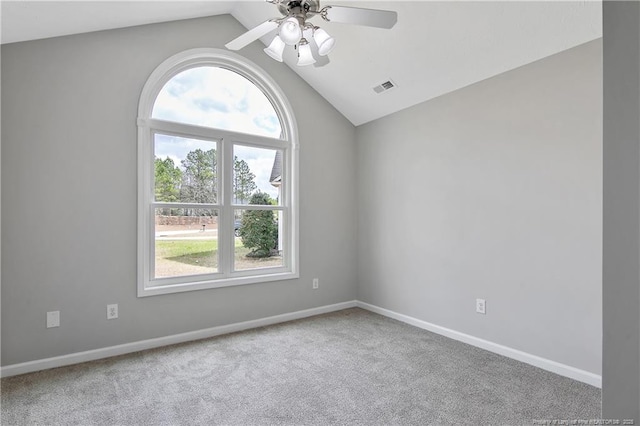 unfurnished room featuring ceiling fan, carpet floors, visible vents, baseboards, and vaulted ceiling