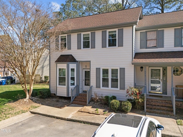 view of front of house featuring covered porch and roof with shingles