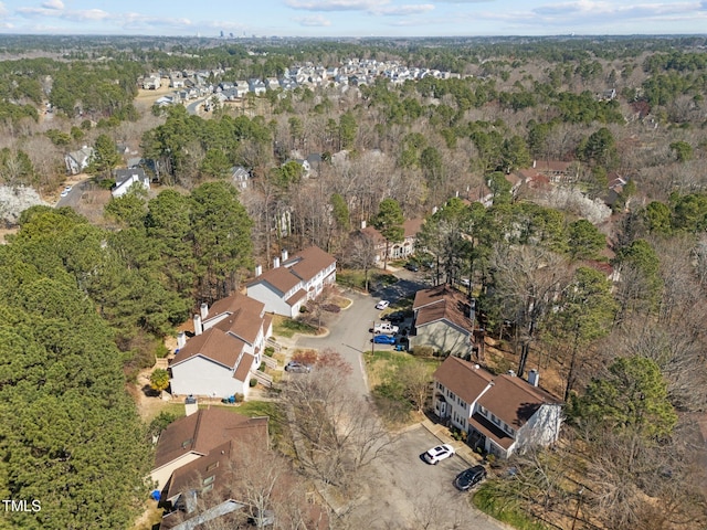 aerial view with a residential view and a wooded view