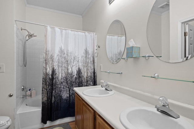 bathroom with visible vents, ornamental molding, and a sink