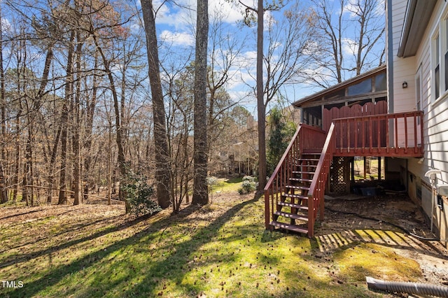 view of yard featuring stairway and a deck