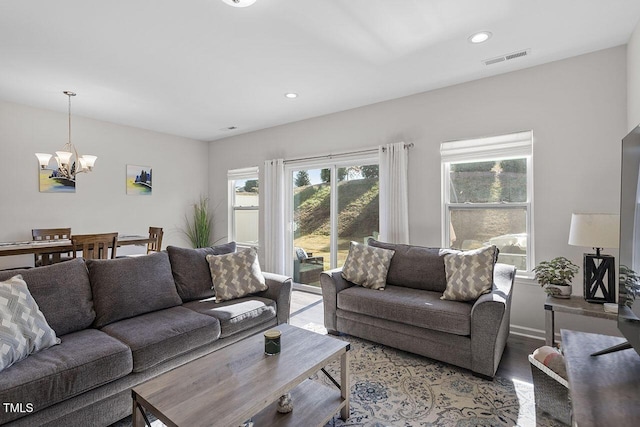 living room with a notable chandelier, recessed lighting, visible vents, and light wood finished floors