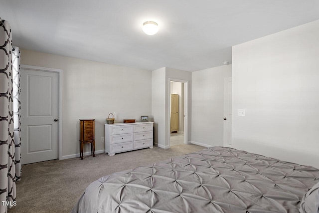 bedroom featuring baseboards and light carpet