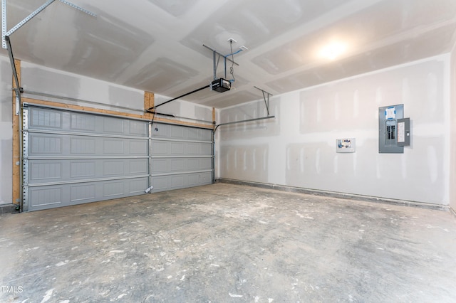 garage with electric panel and a garage door opener