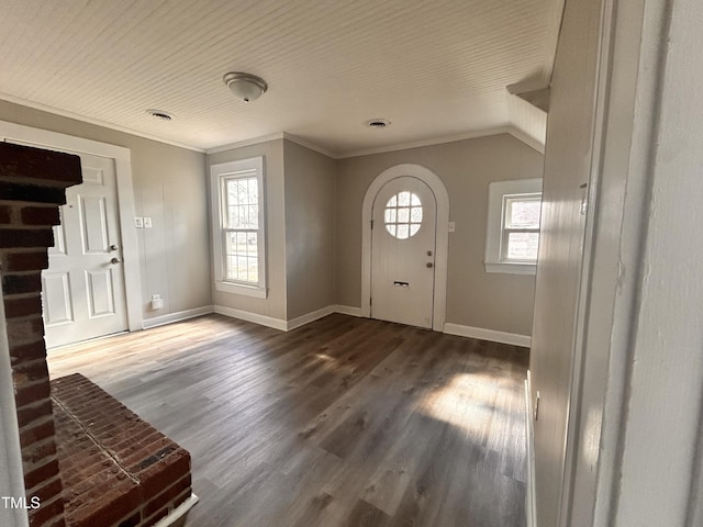 foyer entrance featuring ornamental molding, wood finished floors, visible vents, and baseboards