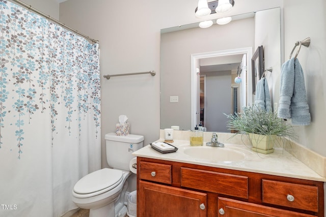 full bath with a shower with curtain, toilet, and vanity