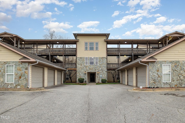 view of property featuring community garages