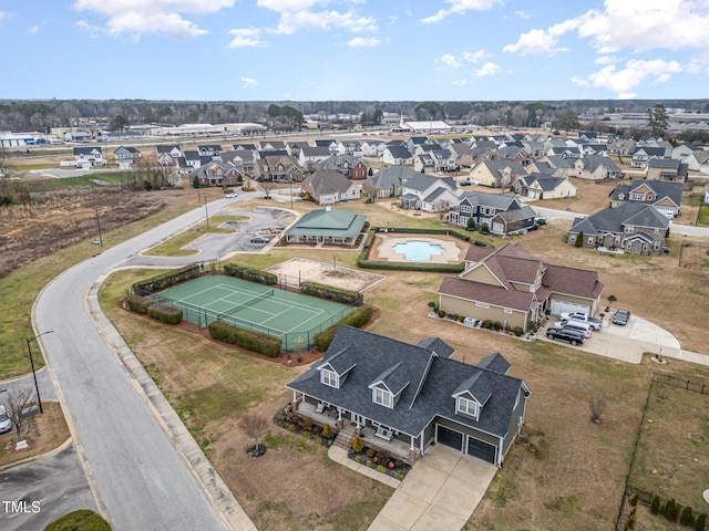 birds eye view of property with a residential view