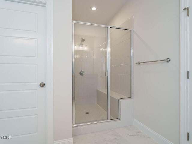 bathroom featuring recessed lighting, marble finish floor, a shower stall, and baseboards