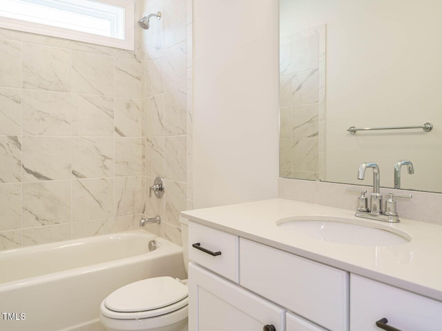 full bath with toilet,  shower combination, and vanity