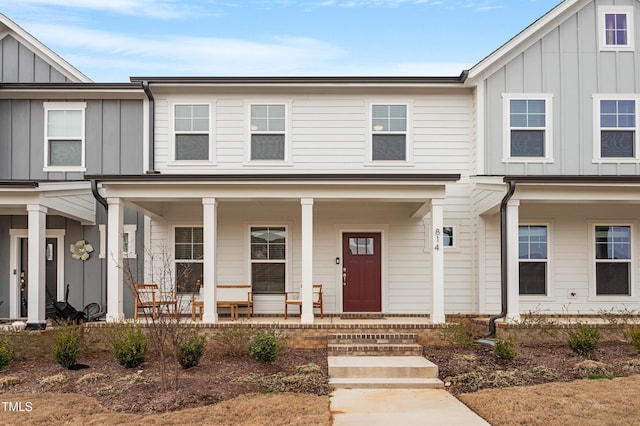 multi unit property with a porch and board and batten siding