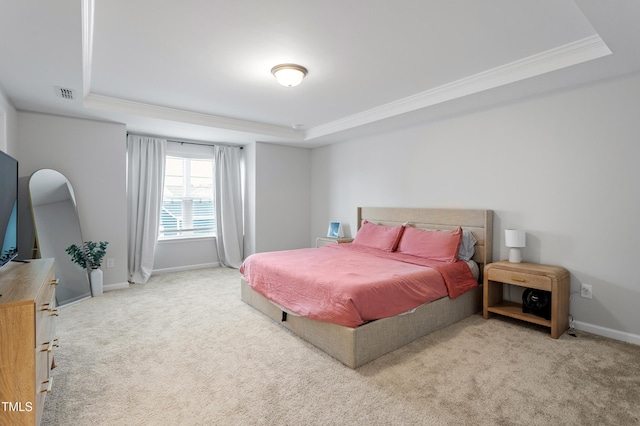 bedroom featuring visible vents, a tray ceiling, and carpet floors