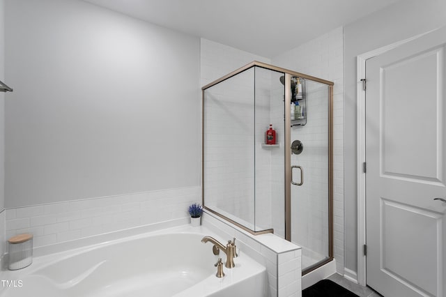 full bathroom with a garden tub and a stall shower