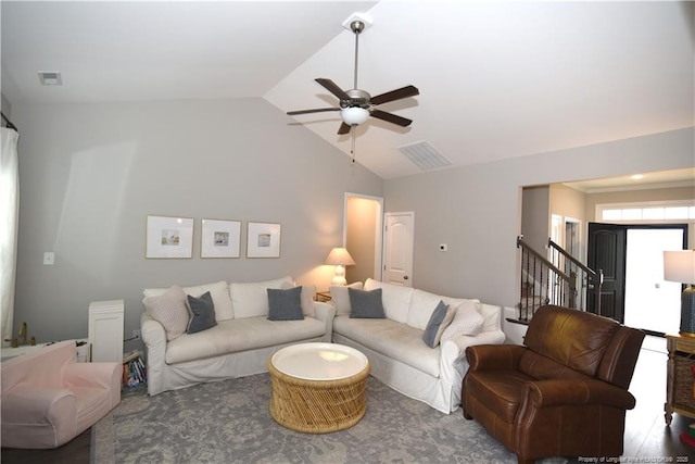 living room with vaulted ceiling, stairway, visible vents, and a ceiling fan