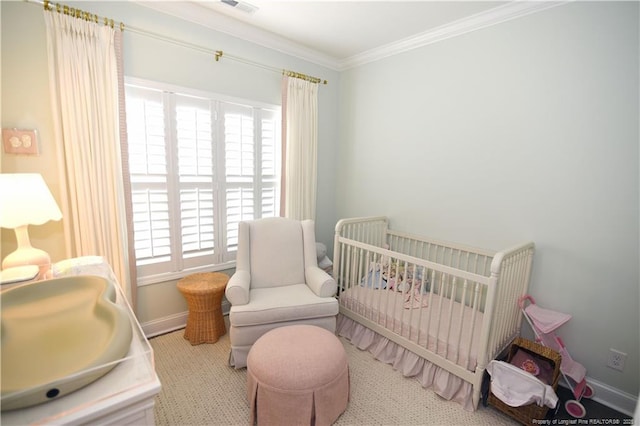 bedroom with a nursery area, visible vents, baseboards, and crown molding