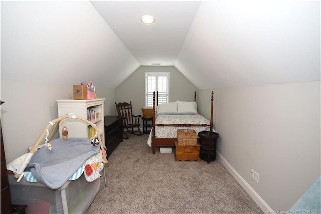 bedroom featuring vaulted ceiling, carpet flooring, and baseboards