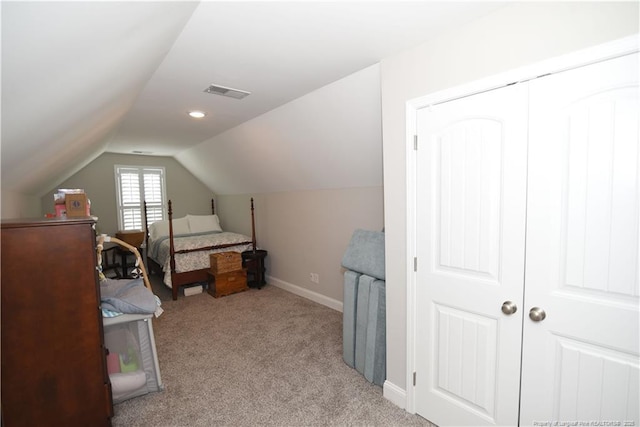 bedroom featuring baseboards, visible vents, vaulted ceiling, and carpet flooring