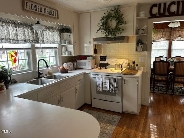 kitchen featuring a sink, white appliances, extractor fan, and open shelves