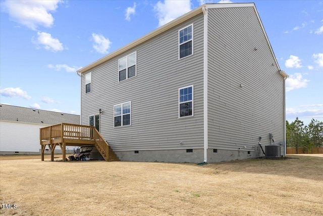 back of house with a deck, cooling unit, crawl space, and stairway