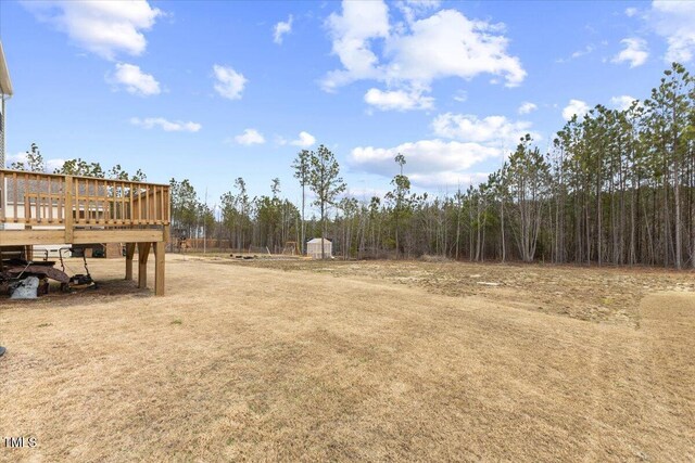 view of yard featuring a wooden deck