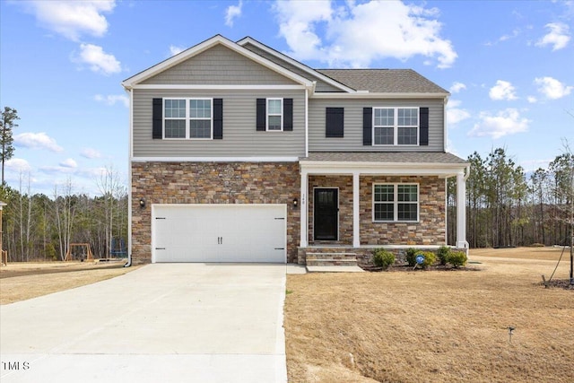 craftsman house with concrete driveway, stone siding, an attached garage, a porch, and a front yard