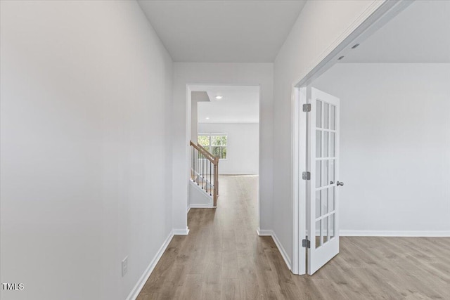 hall featuring stairs, baseboards, wood finished floors, and recessed lighting